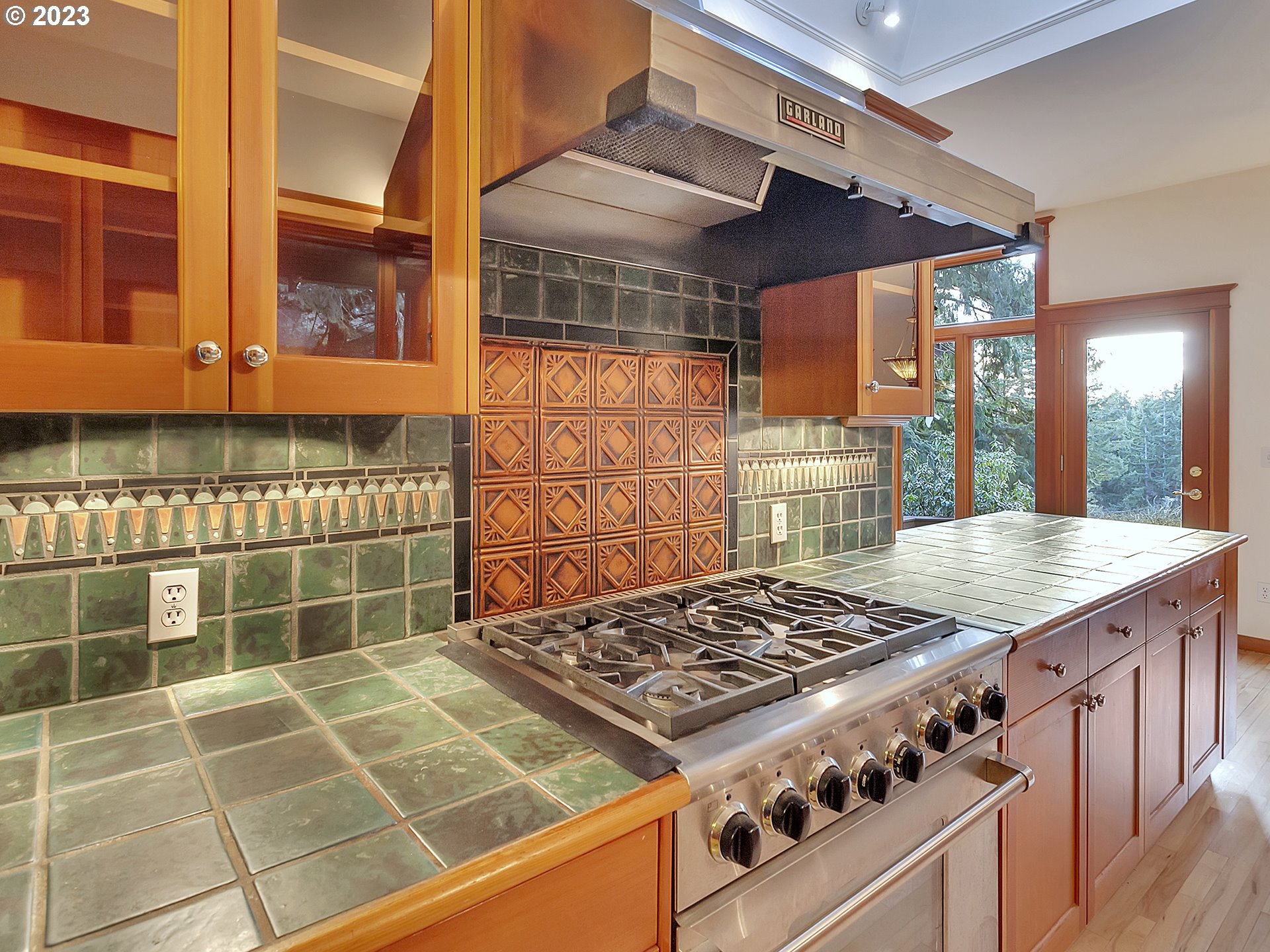 11310 Northwest Plainview Road Portland, OR 97231 - Photo 11 of 32 a kitchen with a stove and a sink