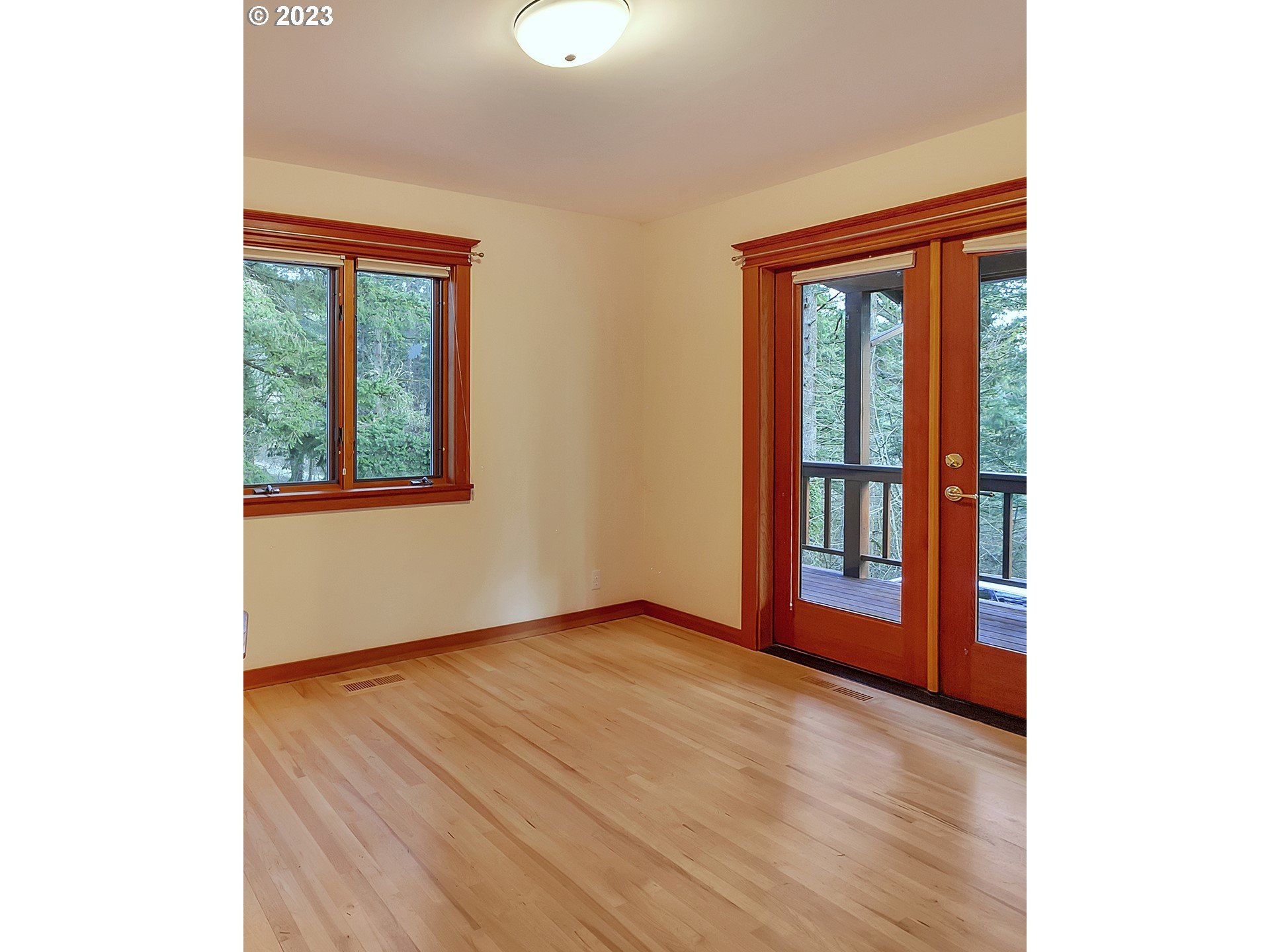 11310 Northwest Plainview Road Portland, OR 97231 - Photo 15 of 32 a view of an empty room with glass door