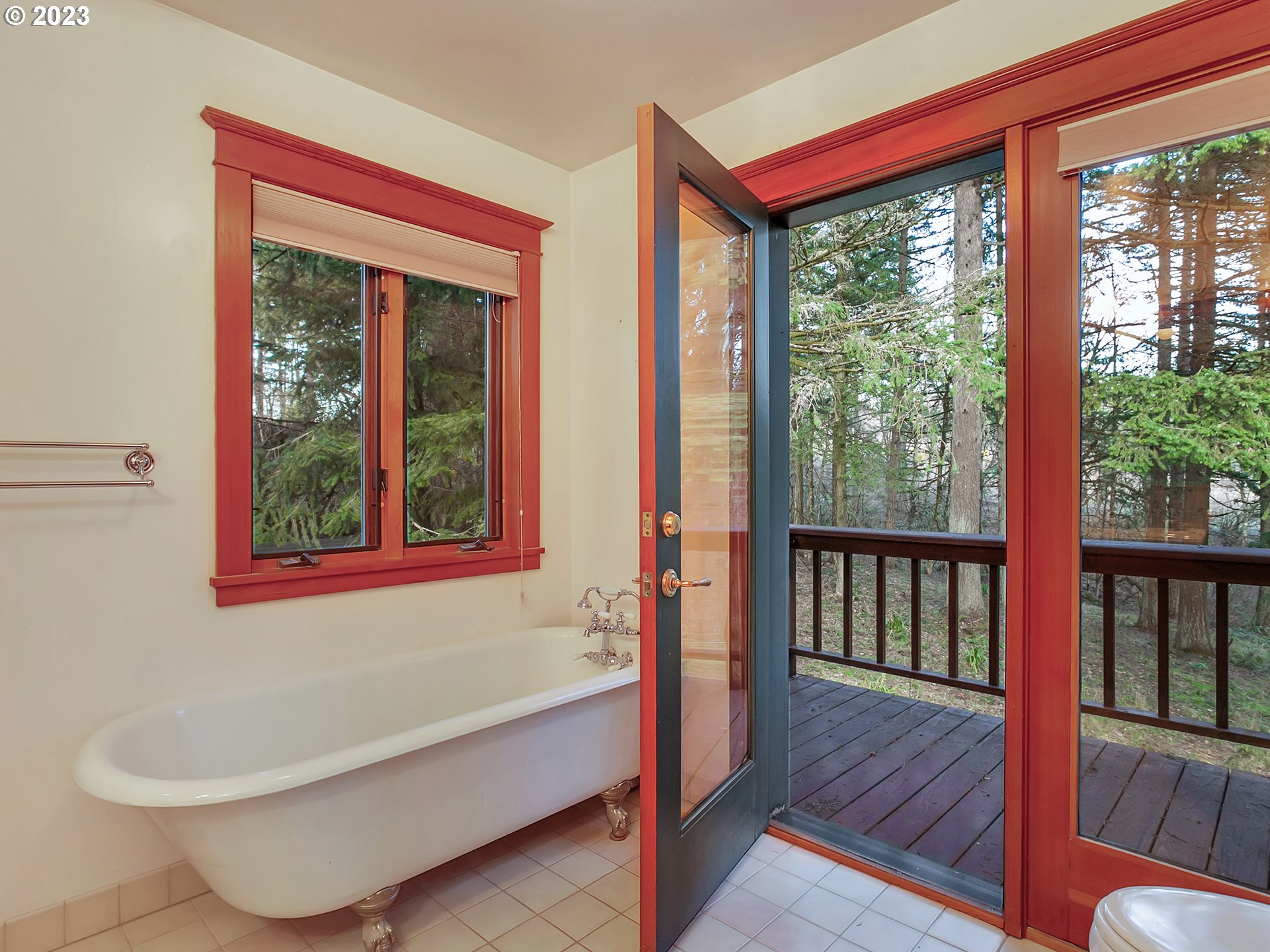 11310 Northwest Plainview Road Portland, OR 97231 - Photo 21 of 32 a bathroom with a bathtub and window
