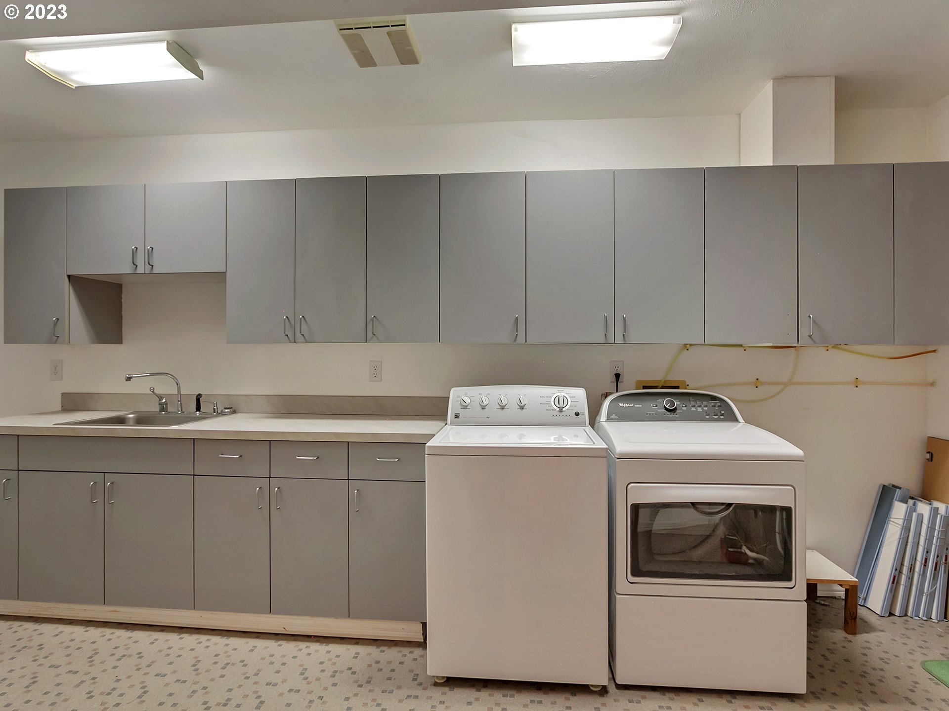 11310 Northwest Plainview Road Portland, OR 97231 - Photo 26 of 32 a utility room with cabinets washer and dryer