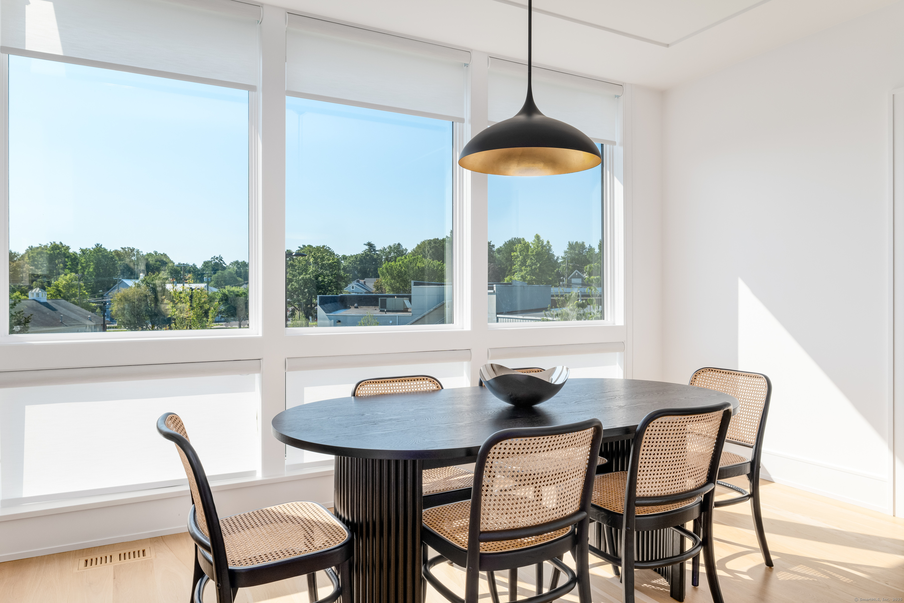 785 Post Road East, Unit 102 Westport, CT 06880 - Photo 15 of 40 a view of a dining room with furniture window and outside view