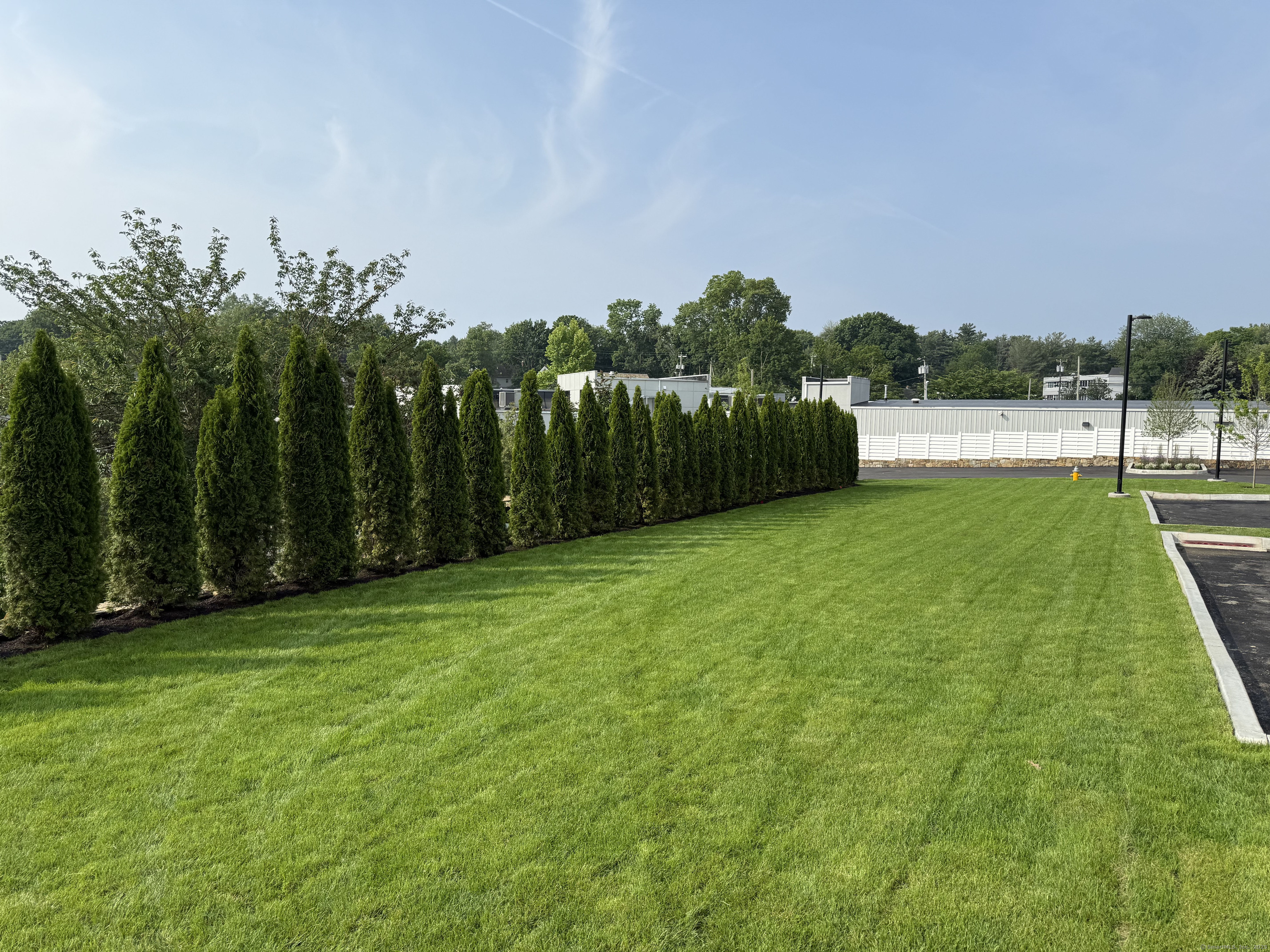 785 Post Road East, Unit 102 Westport, CT 06880 - Photo 29 of 40 a view of a backyard