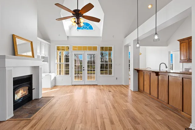 a view of an entryway with wooden floor and front door