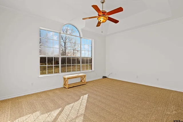 a large bathroom with a granite countertop double vanity sink a mirror and a shower