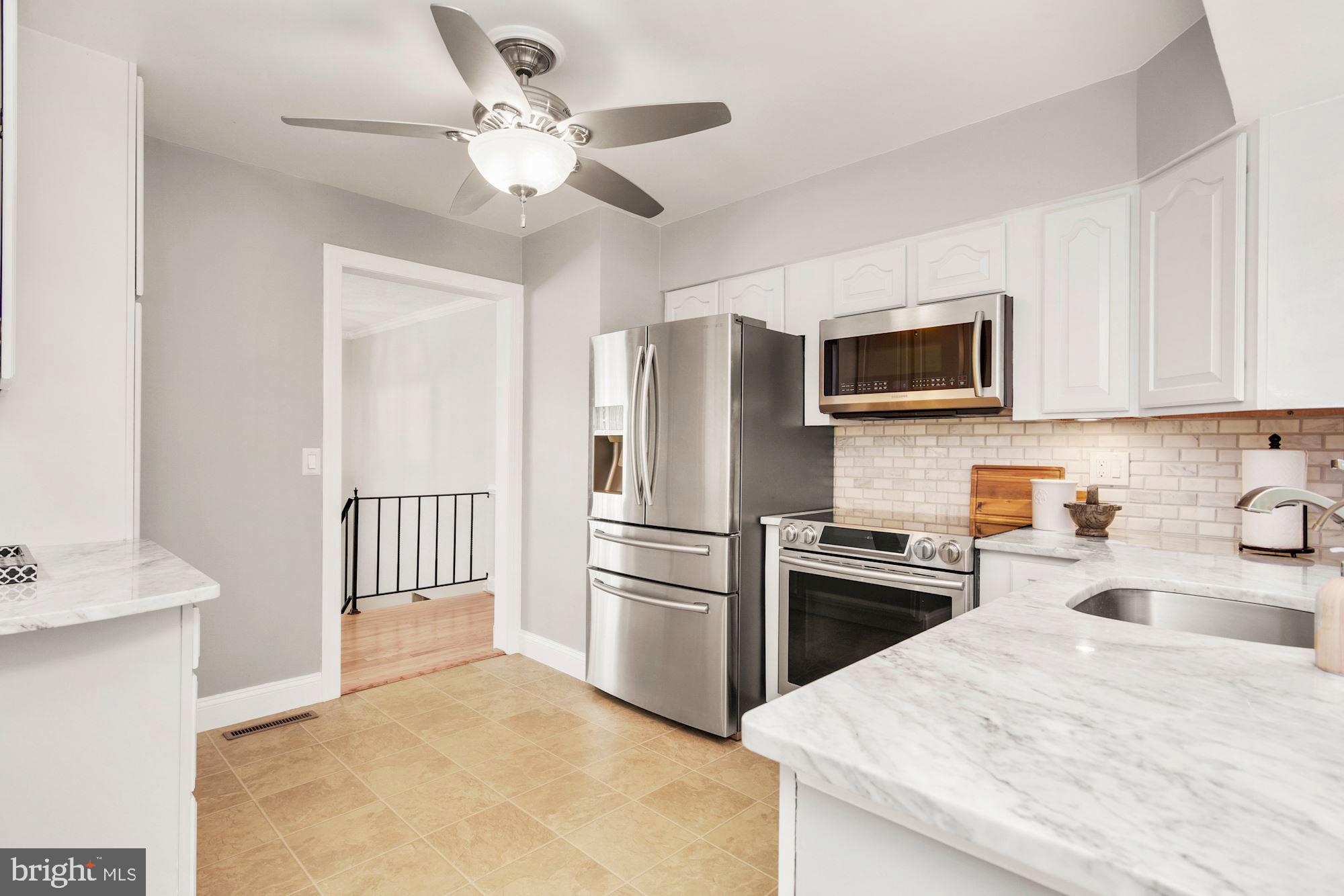 1005 Old Bay Ridge Road Annapolis, MD 21403 - Photo 17 of 56 Check out those countertops and the backsplash!