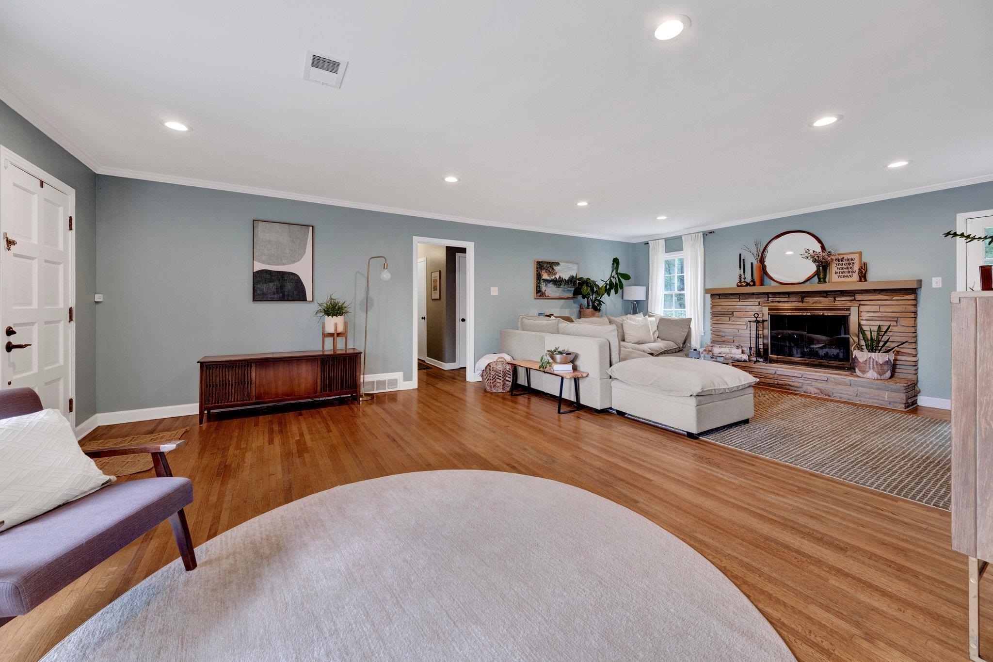 5543 Walnut Grove Road Memphis, TN 38120 - Photo 4 of 25 a living room with furniture and a fireplace