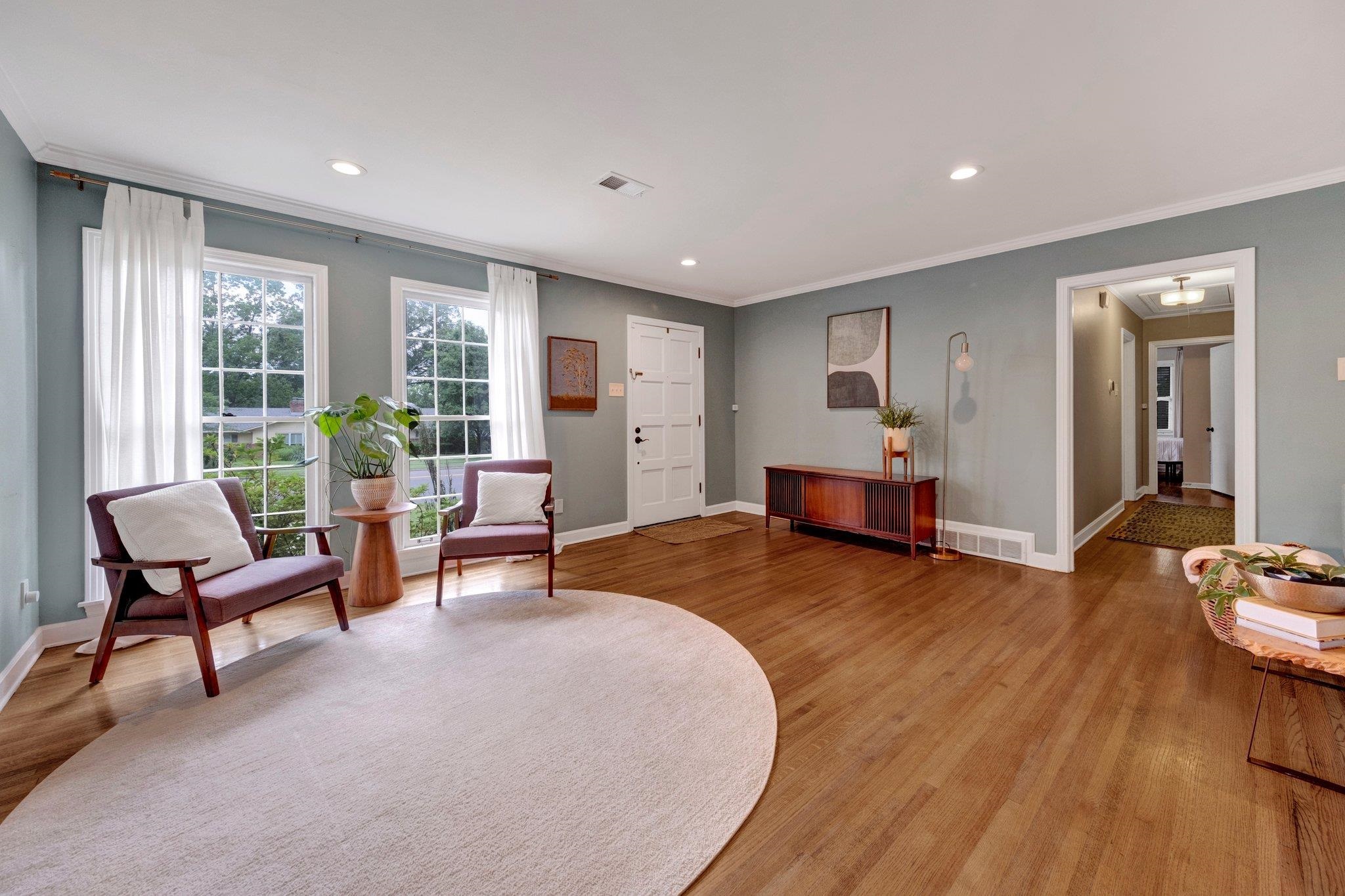5543 Walnut Grove Road Memphis, TN 38120 - Photo 7 of 25 a bedroom with furniture and a wooden floor