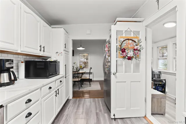 a kitchen with stainless steel appliances a white stove top oven and a refrigerator