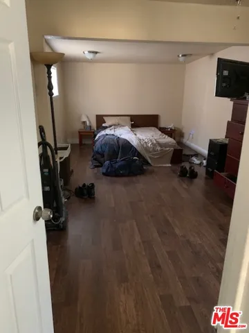 a bed room with a bed and a desk