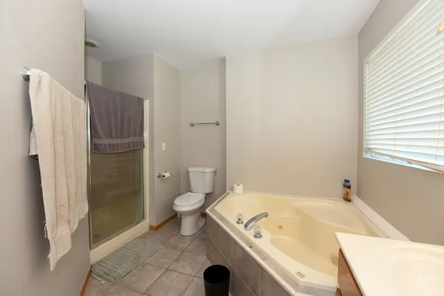 a bathroom with a tub and shower
