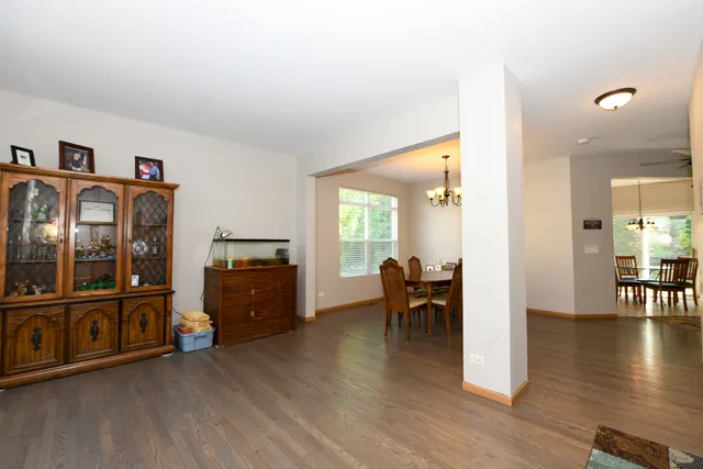 a view of a livingroom with furniture and hardwood floor