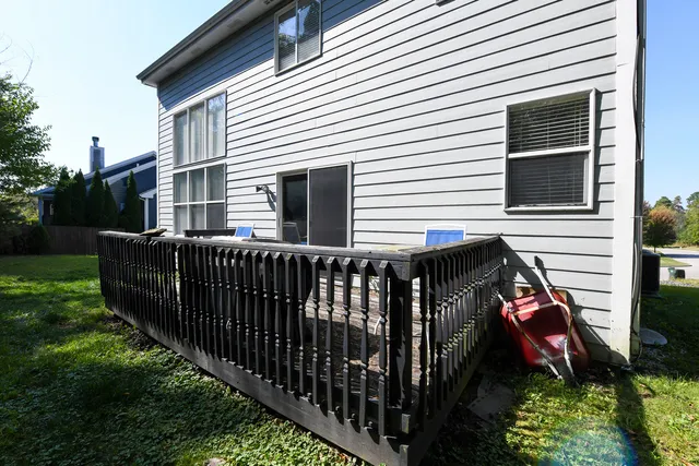 a view of a house with backyard and porch