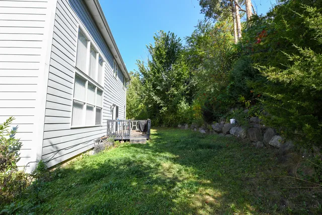 a view of a house with a backyard