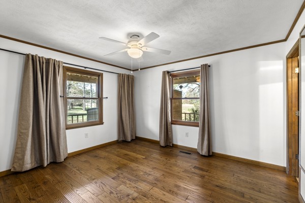 3778 Highway 100 Centerville, TN 37033 - Photo 21 of 59 a view of an empty room with window and wooden floor