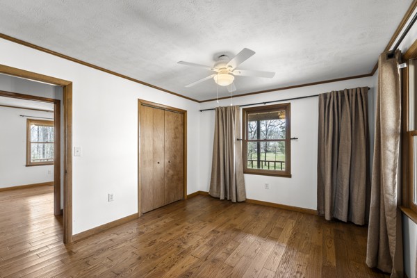 3778 Highway 100 Centerville, TN 37033 - Photo 23 of 59 a view of an empty room with a window and wooden floor