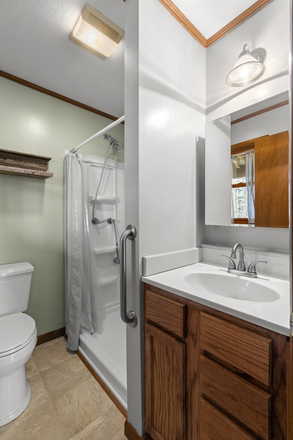 3778 Highway 100 Centerville, TN 37033 - Photo 25 of 59 a bathroom with a sink a toilet and shower