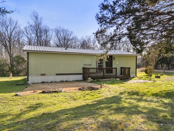 3778 Highway 100 Centerville, TN 37033 - Photo 39 of 59 a house view with a swimming pool next to a yard