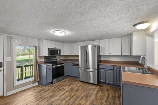 3778 Highway 100 Centerville, TN 37033 - Photo 42 of 59 a kitchen with refrigerator a stove a sink and a microwave