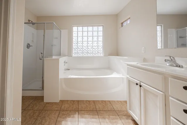 a bathroom with a bathtub and a sink