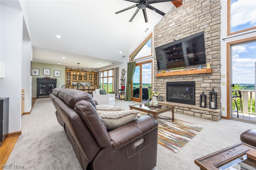 1602 Glendale Road, Unit 3 Marietta, OH 45750 - Photo 7 of 49 Spacious living area featuring a vaulted ceiling and a floor-to-ceiling stone fireplace