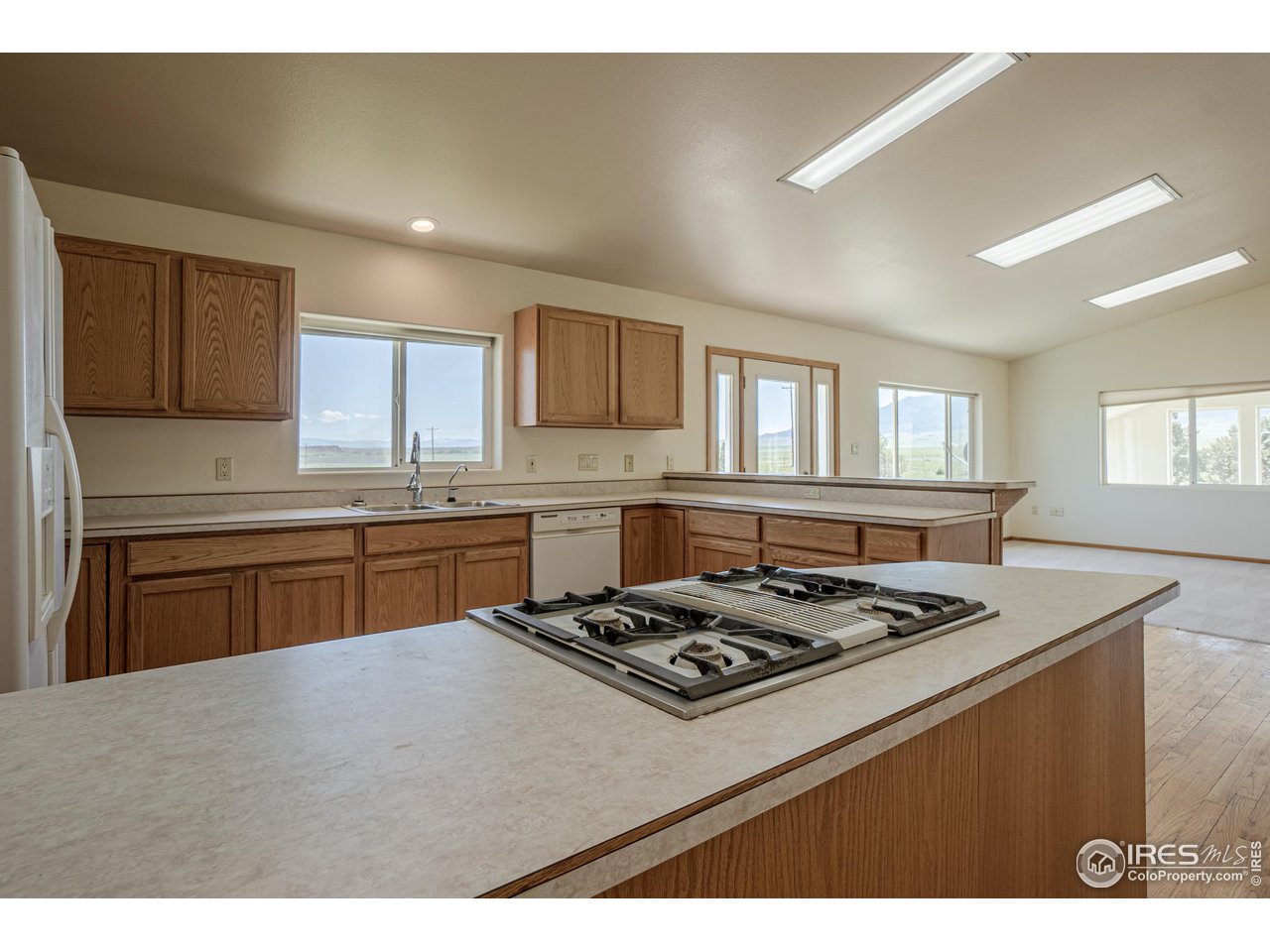 620 County Road 670 Rye, CO 81069 - Photo 20 of 40 a kitchen with a stove a sink a refrigerator dining table and chairs