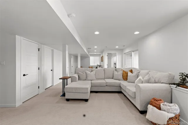 a kitchen with stainless steel appliances granite countertop a sink a stove and refrigerator