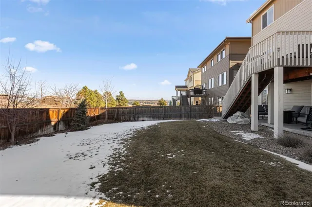 a view of a dining room with furniture wooden floor and chandelier