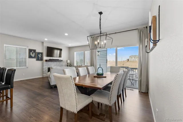 a bedroom with a bed and a flat tv screen on dresser