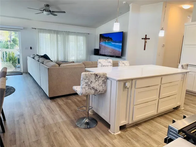 a kitchen with stainless steel appliances a stove a sink and a refrigerator