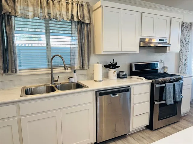 a bedroom with a bed flat screen tv and a large window