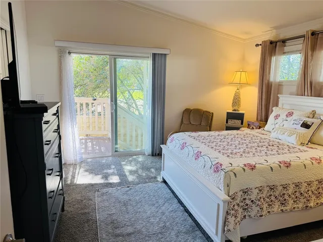 a bedroom with a bed and a mirror