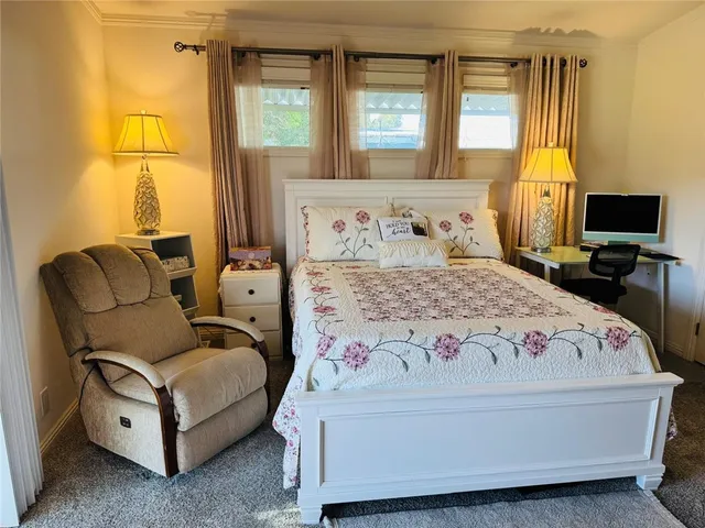 a bathroom with a sink mirror vanity and toilet