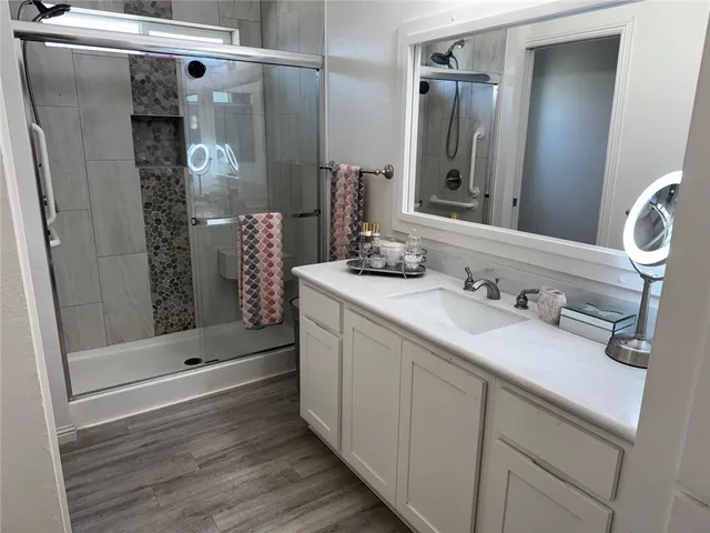 a view of a chairs and table in the balcony
