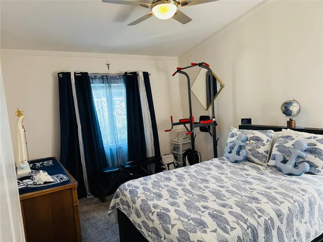 a view of a porch with furniture and a yard