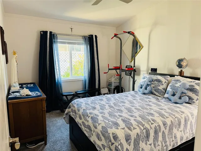 a view of a patio with table and chairs potted plants
