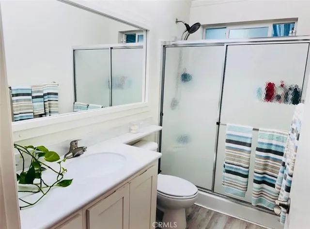 a view of a dining room with furniture and a potted plant