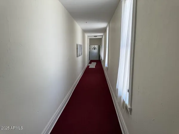a utility room with wooden floor washer and dryer