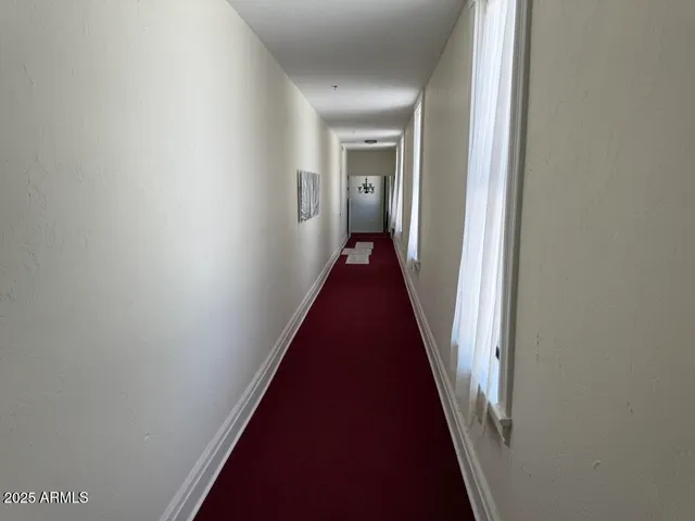 a utility room with wooden floor washer and dryer
