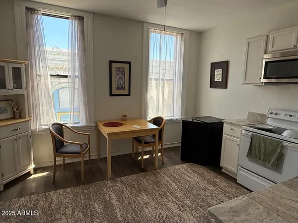 a white toilet sitting next to a shower