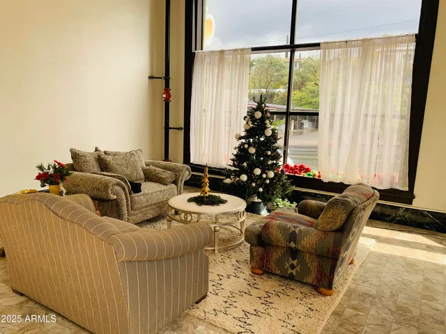 a view of a bedroom with wooden floor and bedroom