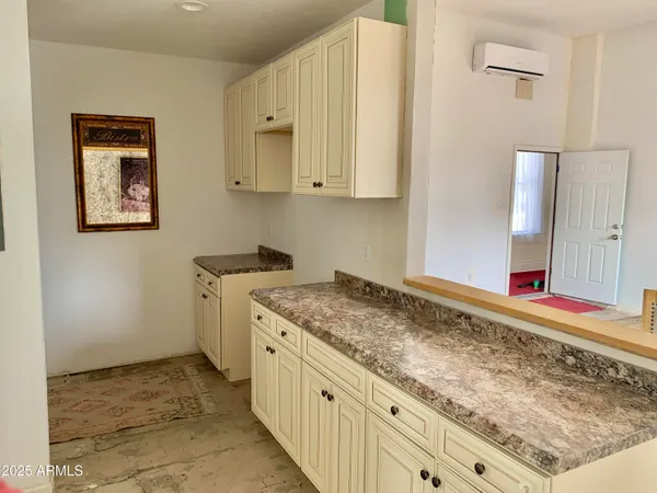 a view of a hallway with wooden floor and a hallway