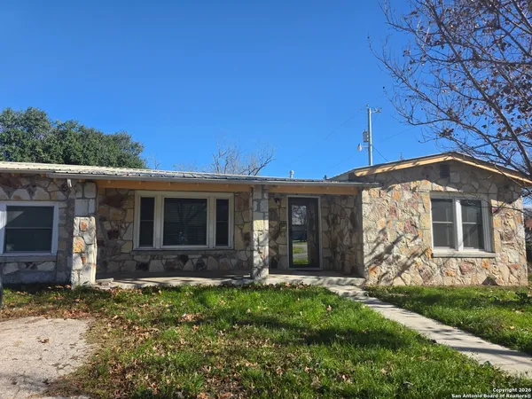 front view of a house with a yard