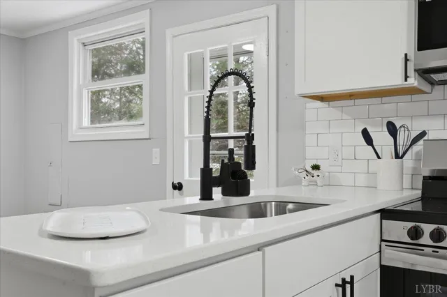 a kitchen with a sink and a window
