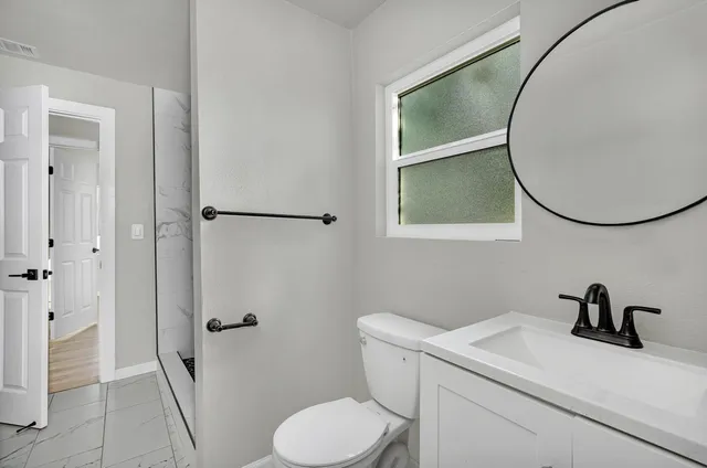 a view of kitchen with furniture and wooden floor