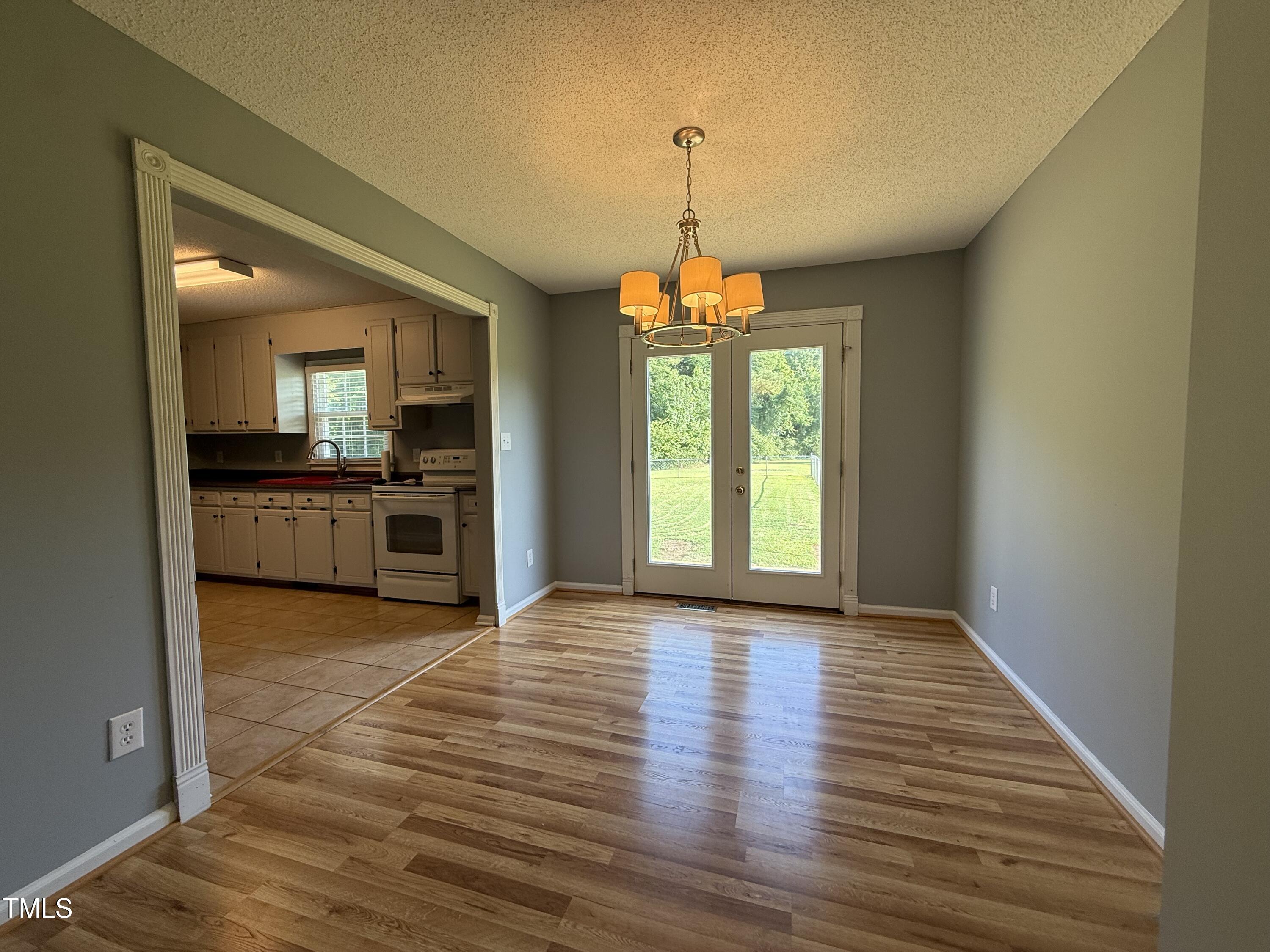 152 Christopher Avenue Princeton, NC 27569 - Photo 14 of 24 a view of a kitchen with a stove cabinets and wooden floor