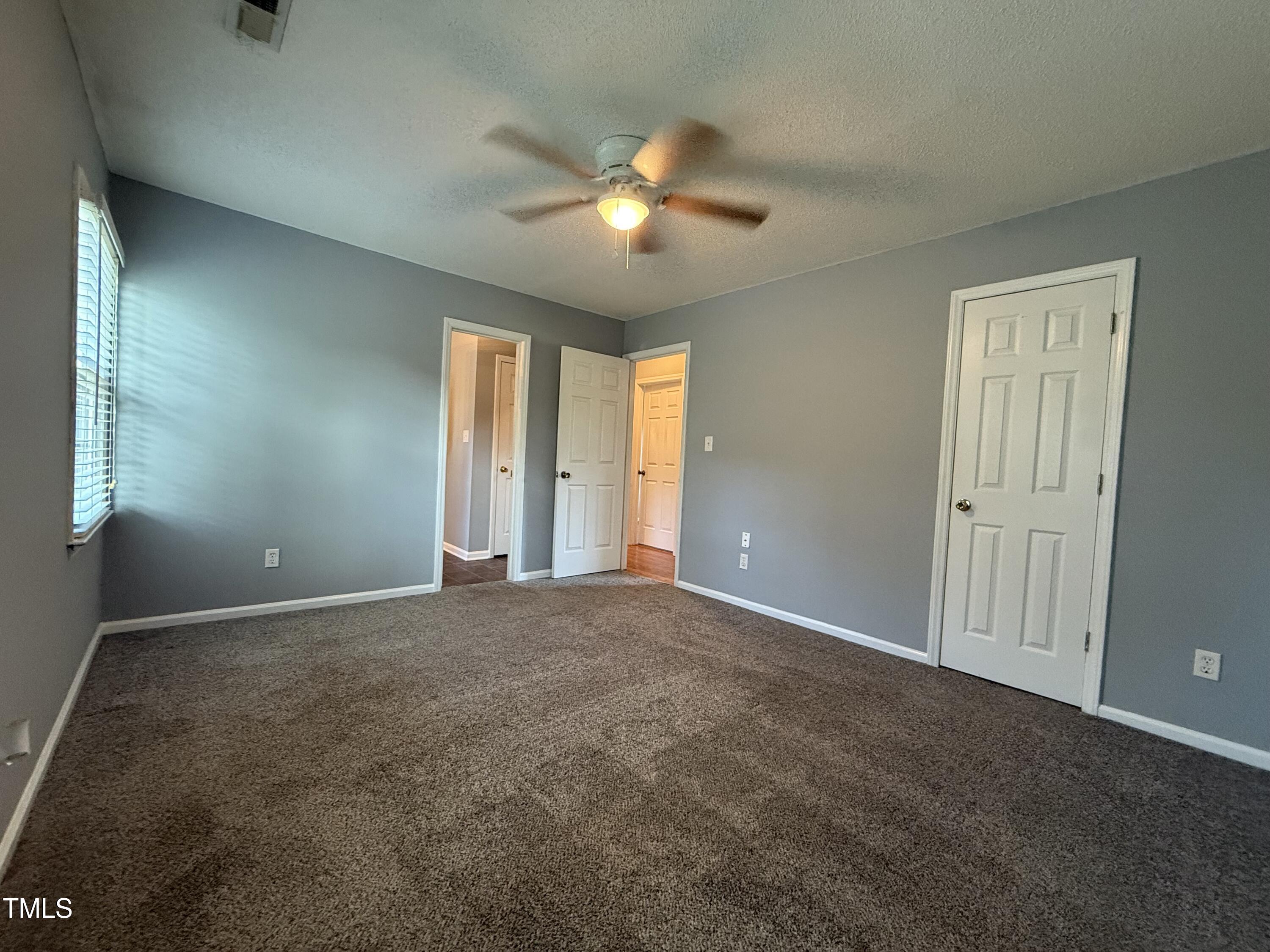 152 Christopher Avenue Princeton, NC 27569 - Photo 19 of 24 a view of an empty room with a window