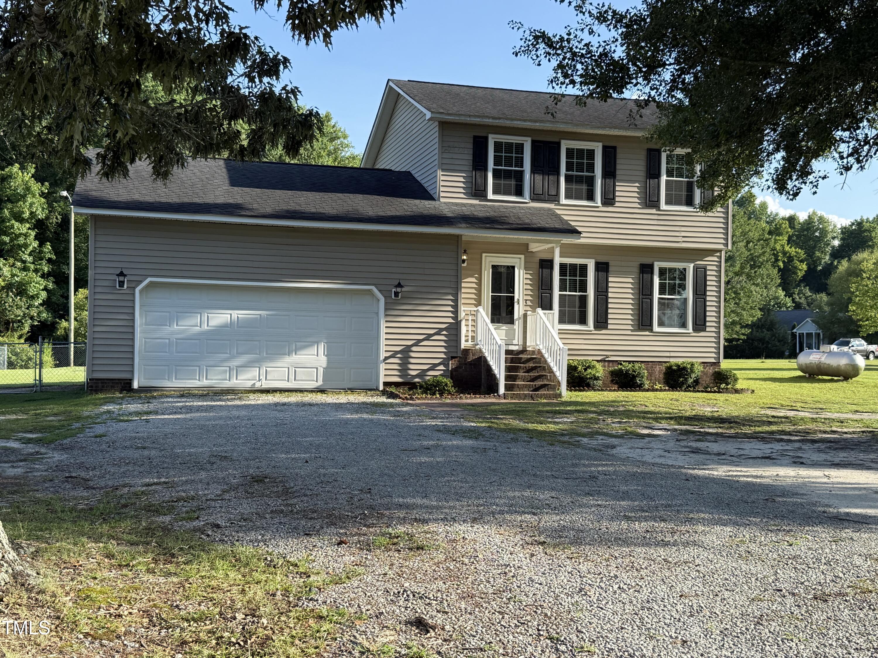 152 Christopher Avenue Princeton, NC 27569 - Photo 2 of 24 a front view of a house with a yard