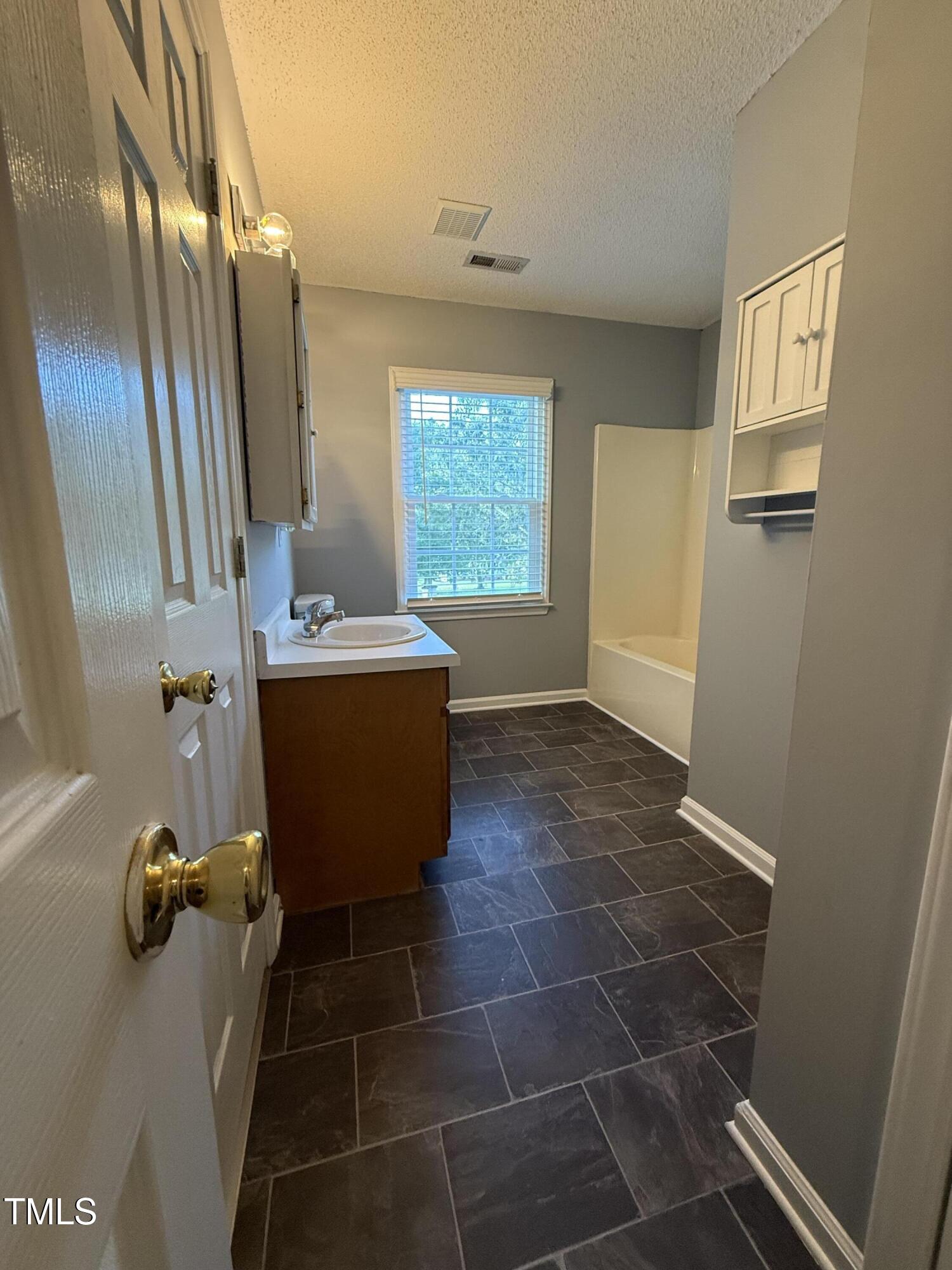 152 Christopher Avenue Princeton, NC 27569 - Photo 22 of 24 a room with a window and chairs