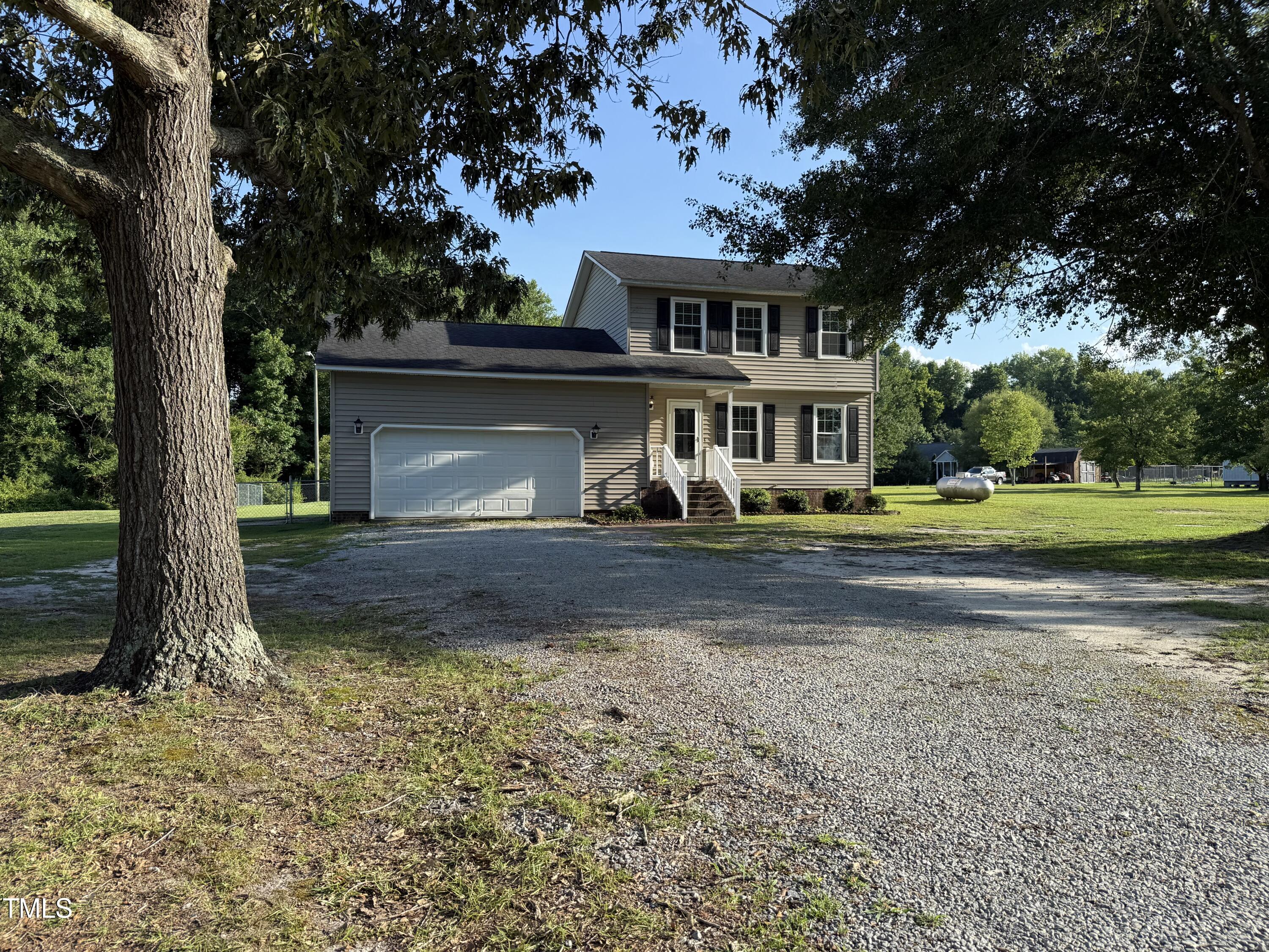 152 Christopher Avenue Princeton, NC 27569 - Photo 3 of 24 a front view of a house with a yard