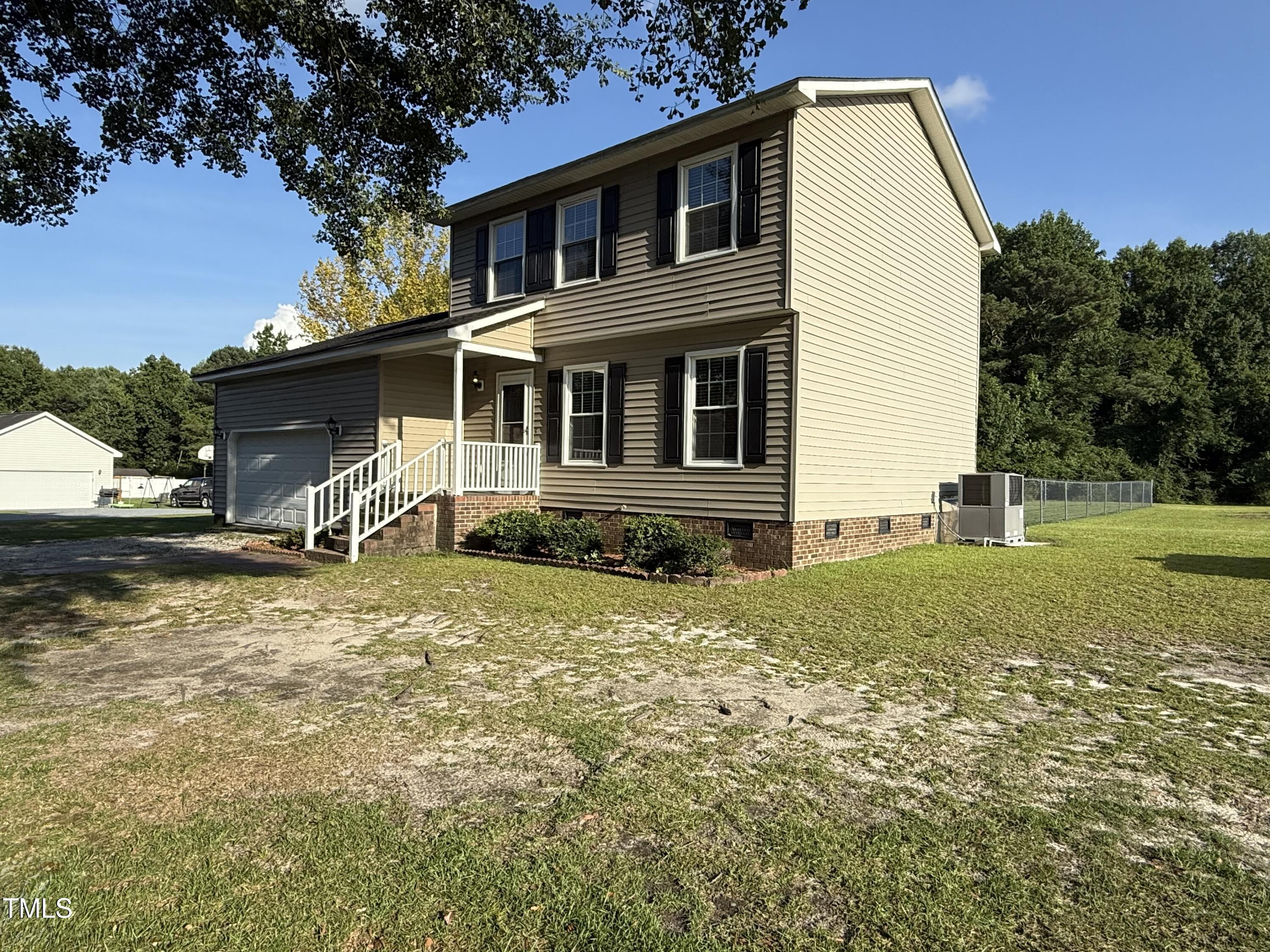 152 Christopher Avenue Princeton, NC 27569 - Photo 4 of 24 a front view of a house with garden